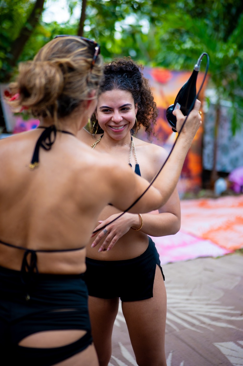 Two friends smiling at the glam station